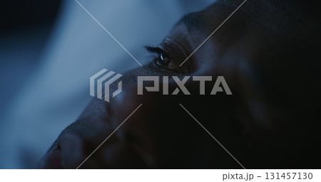 Man Lying in Bed at Night, Scrolling Through Social Media 131457130