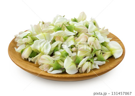 flowers of Sophora japonica or Styphnolobium japonicum in wooden bowl isolated on white background 131457867