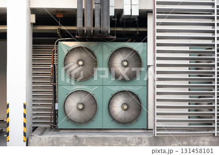 Condenser unit installed on exterior wall. 131458101