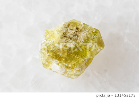 sample of raw chrysoberyl mineral on white marble sample of raw chrysoberyl mineral on white marble 131458175