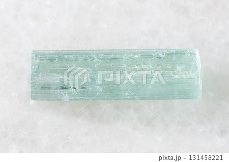 sample of raw aquamarine crystal on white marble sample of raw aquamarine crystal on white marble 131458221