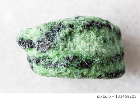 sample of raw zoisite mineral on white marble sample of raw zoisite mineral on white marble 131458225