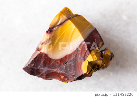 sample of raw colorful mookaite mineral on white 131458226