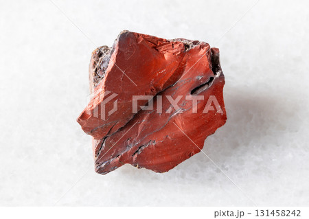 sample of raw red mookaite mineral on white sample of raw red mookaite mineral on white 131458242