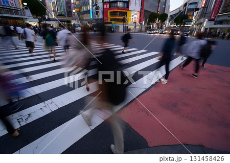 Shibuya scramble crossing at blue hour, motion blur of crowds crossing in big city, urban life and movement Shibuya scramble crossing at blue hour, motion blur of crowds crossing in big city, urban life and movement 131458426