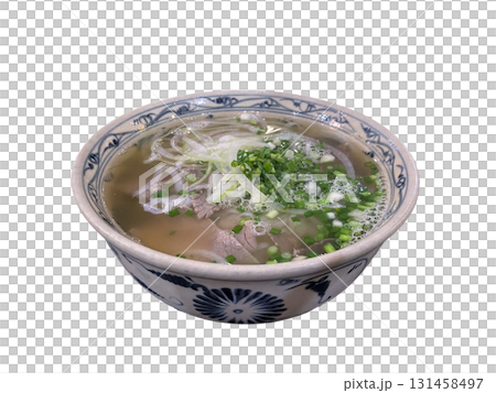 Delicious Vietnamese pho noodle soup with beef and fresh herbs in traditional bowl 131458497