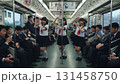 山手線を背景にセーラー服姿のアジア人女性3人がポーズを決めるシンクロ写真 131458750