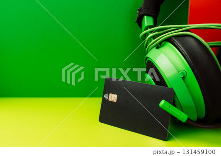 Black contactless bank card on green background for Black Friday and Cyber Monday shopping Black contactless bank card on green background for Black Friday and Cyber Monday shopping 131459100