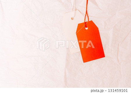 Blank price tags on white crumpled paper background sale discount concept Blank price tags on white crumpled paper background sale discount concept 131459101