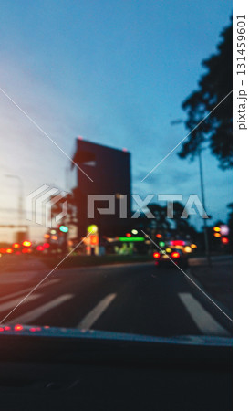 Twilight driving on city highway, blurred tail lights. Road safe, vertical Twilight driving on city highway, blurred tail lights. Road safe, vertical 131459601