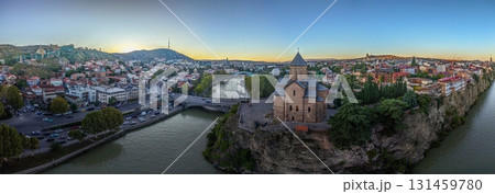 Tbilisi panorama with Kura river and Metekhi church at sunset Tbilisi panorama with Kura river and Metekhi church at sunset 131459780