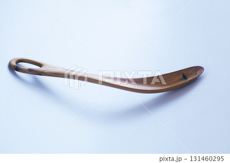 Wooden kitchen utensils stacked view close up isolated 131460295