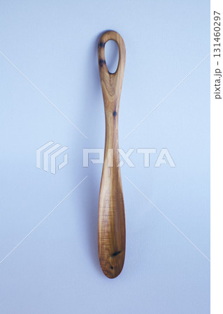 Wooden kitchen utensils stacked view close up isolated 131460297