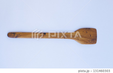 Wooden kitchen utensils stacked view close up isolated 131460303