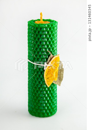 Natural wax candles with bay leaf and dried orange for rituals and space cleansing Natural wax candles with bay leaf and dried orange for rituals and space cleansing 131460345