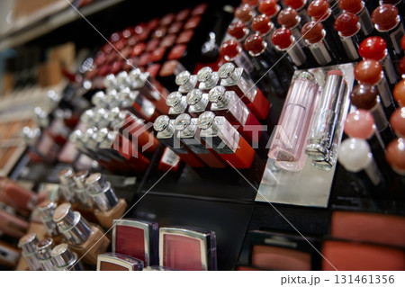 Here is an attractive display showcasing lipsticks and various cosmetics 131461356