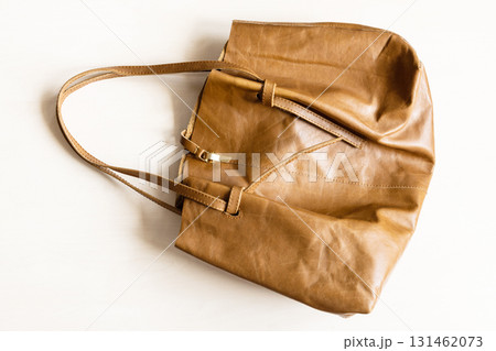 soft leather tote bag on wooden table 131462073