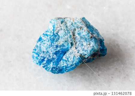 sample of unworked apatite rock on white marble sample of unworked apatite rock on white marble 131462078