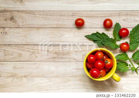 cherry tomatoes on wooden table background cherry tomatoes on wooden table background 131462220