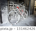 Bicycle covered in soapy foam at car wash. Cleaning bike, end of cycling season 131462426