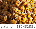 A heap of raisins. A pile of yellow raisins. A dried fruit background 131462581