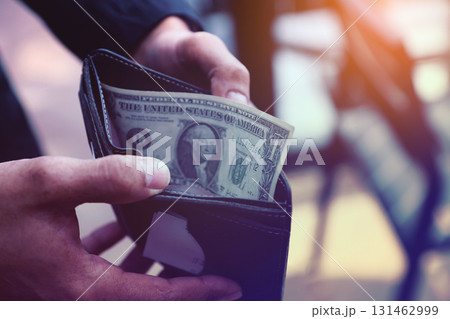 Hand Holding Cash in a Wallet, The Last Dollar 131462999