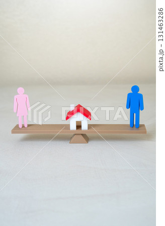A man, a woman, and a house in the balance. Domestic responsibilities. The right to jointly owned property in case of divorce. Useful for law, real estate and family relations. A man, a woman, and a house in the balance. Domestic responsibilities. The right to jointly owned property in case of divorce. Useful for law, real estate and family relations. 131463286