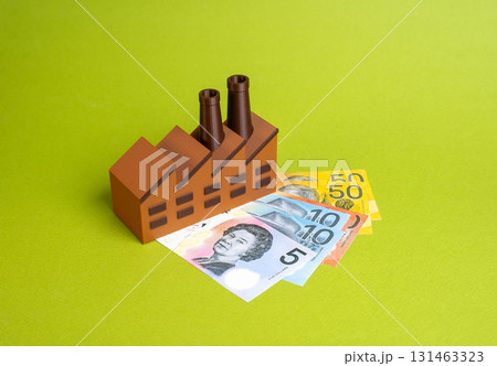 Industrial plant and Australian banknotes. Industrial wages. Taxes or enterprise subsidies. Investments and budgeting. Concept for economic growth, corporate finance, trade and labor markets. Industrial plant and Australian banknotes. Industrial wages. Taxes or enterprise subsidies. Investments and budgeting. Concept for economic growth, corporate finance, trade and labor markets. 131463323