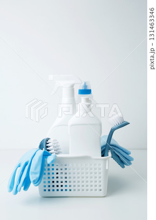 Cleaning supplies in a container, ready for a productive and satisfying spring refresh. Household cleaning and hygiene concept Cleaning supplies in a container, ready for a productive and satisfying spring refresh. Household cleaning and hygiene concept 131463346