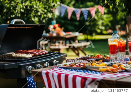 Picnic setup with BBQ grill, food and drinks, patriotic decorations for Labor Day celebration Picnic setup with BBQ grill, food and drinks, patriotic decorations for Labor Day celebration 131463777
