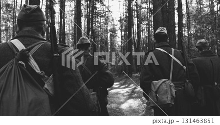 Russian Soviet Infantry Red Army Soldiers Of World War II Marching Walking Along Forest Lane Road In Spring Autumn Day. Group of Soldiers Marching In Country Road Russian Soviet Infantry Red Army Soldiers Of World War II Marching Walking Along Forest Lane Road In Spring Autumn Day. Group of Soldiers Marching In Country Road 131463851