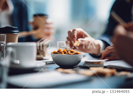 Young adults sharing lunch in office break scene Young adults sharing lunch in office break scene 131464093