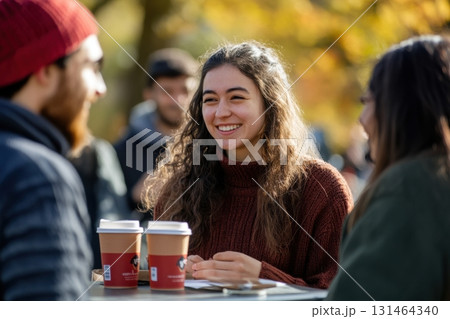 College welcome event outdoors with students meeting 131464340