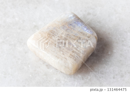 tumbled belomorite moonstone mineral on white 131464475