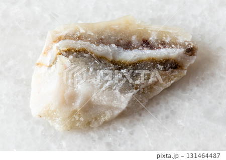 sample of raw shaitan perelivte rock on white 131464487