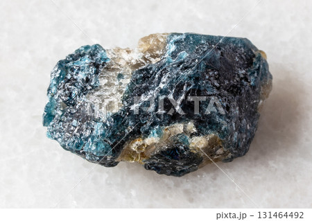 sample of unworked grandidierite mineral on white 131464492
