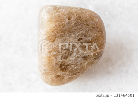 sample of polished cryolite rock on white marble 131464501