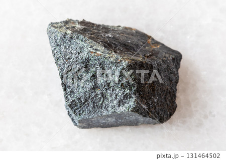 sample of raw peridotitic komatiite rock on white sample of raw peridotitic komatiite rock on white 131464502