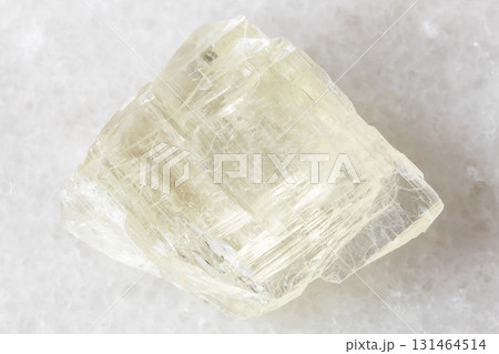 sample of rough spodumene mineral on white marble sample of rough spodumene mineral on white marble 131464514