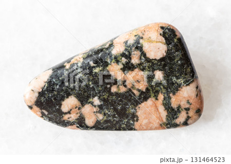 sample of polished gabbro mineral on white marble sample of polished gabbro mineral on white marble 131464523