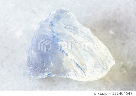 sample of rough molybdenum glass on white marble 131464547