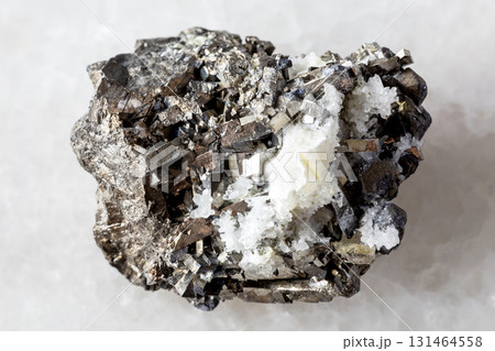sample of raw arsenopyrite mineral on white marble sample of raw arsenopyrite mineral on white marble 131464558