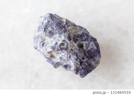 sample of rough cordierite mineral on white marble sample of rough cordierite mineral on white marble 131464559
