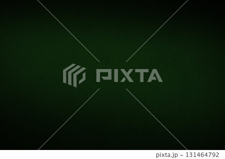 Elegant green background. Grunge background with a rich green wall texture, a shadowed border and a glowing center. 131464792