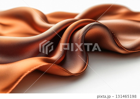 Quality, sophistication and versatility. Flowing silk scarf Mocha Mousse color with soft folds on white surface. Elegant aesthetic. 131465198