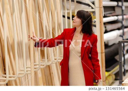 Architect choosing wooden planks in warehouse for construction project 131465564