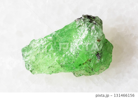 sample of rough tsavorite garnet mineral on white 131466156
