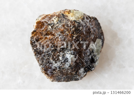 sample of rough brown titanite mineral on white sample of rough brown titanite mineral on white 131466200