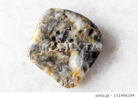 sample of tumbled oncolite mineral on white marble sample of tumbled oncolite mineral on white marble 131466294