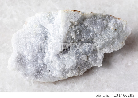 sample of raw jadeite rock on white marble 131466295